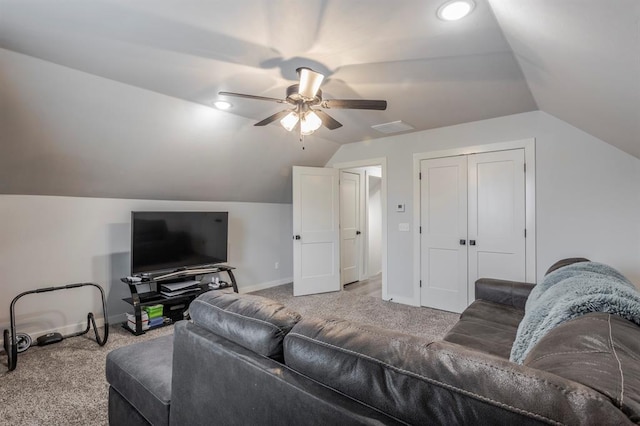 living area featuring vaulted ceiling, ceiling fan, baseboards, and carpet floors