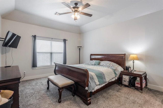 bedroom with visible vents, light colored carpet, baseboards, and ceiling fan