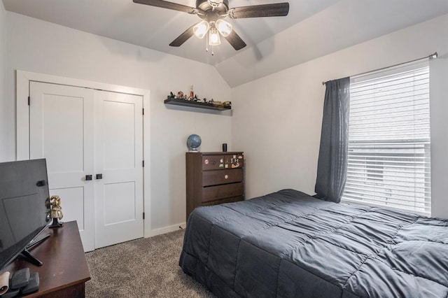 carpeted bedroom featuring a closet, ceiling fan, and vaulted ceiling