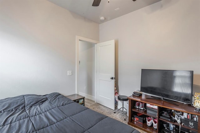 carpeted bedroom with a ceiling fan