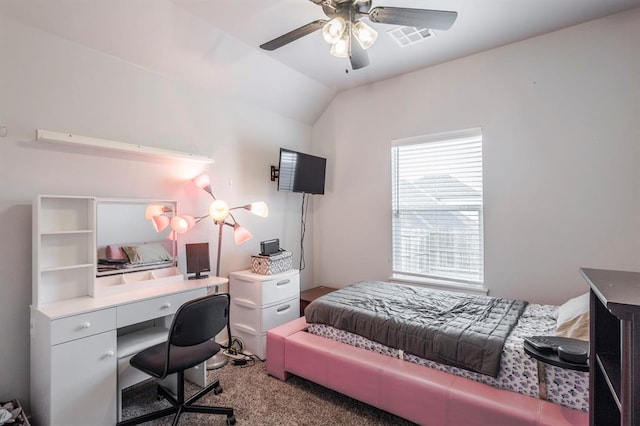 carpeted bedroom featuring lofted ceiling, a ceiling fan, and visible vents