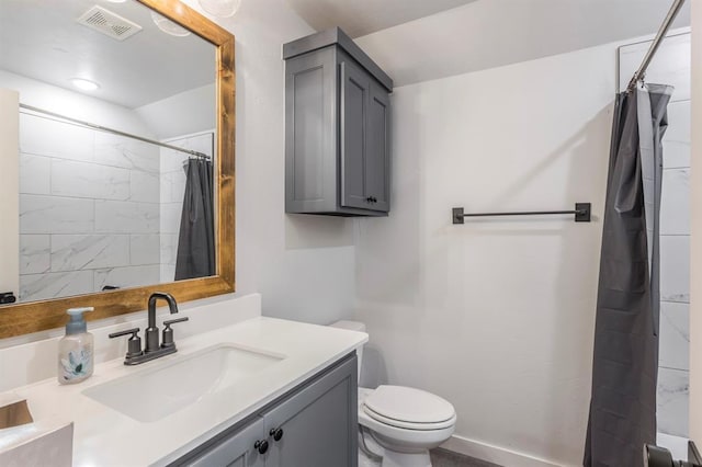 bathroom featuring visible vents, a shower with curtain, toilet, lofted ceiling, and vanity