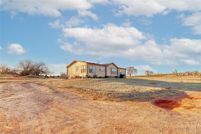 manufactured / mobile home featuring fence and a rural view