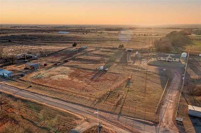 birds eye view of property featuring a rural view