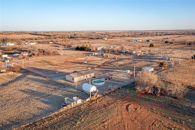 birds eye view of property with a rural view