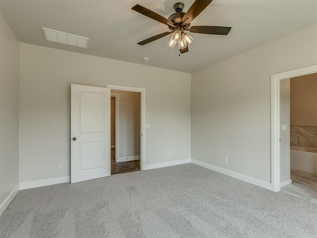 10124 Gentry Xing, Oklahoma City, OK 73169 - unfurnished bedroom featuring carpet and a ceiling fan