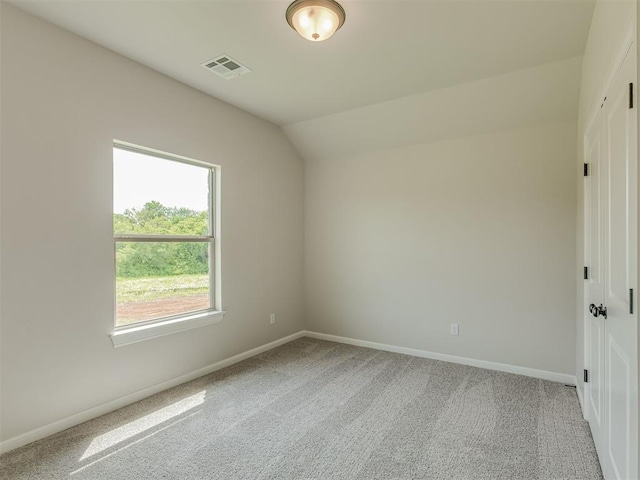 10124 Gentry Xing, Oklahoma City, OK 73169 - carpeted empty room featuring baseboards and lofted ceiling