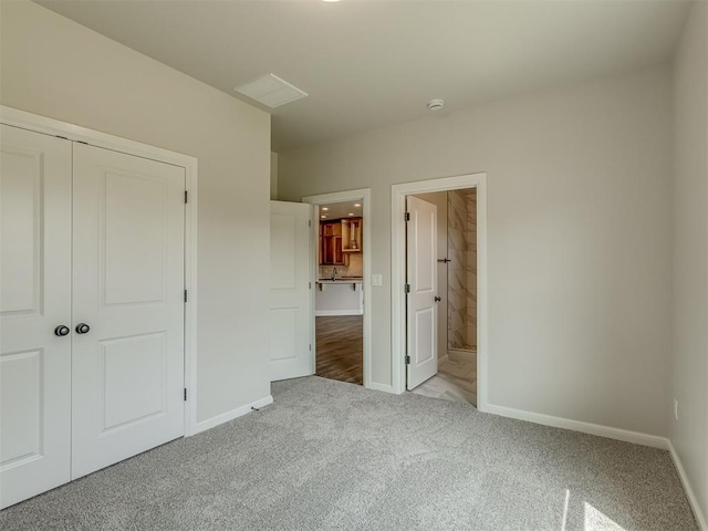 10124 Gentry Xing, Oklahoma City, OK 73169 - unfurnished bedroom with carpet floors, a closet, and ensuite bath