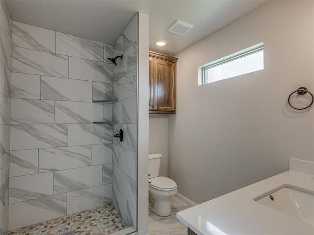 10124 Gentry Xing, Oklahoma City, OK 73169 - bathroom with marble finish floors, vanity, and tiled shower