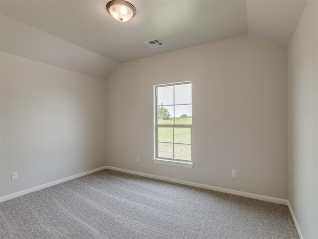 10124 Gentry Xing, Oklahoma City, OK 73169 - carpeted empty room featuring vaulted ceiling and baseboards
