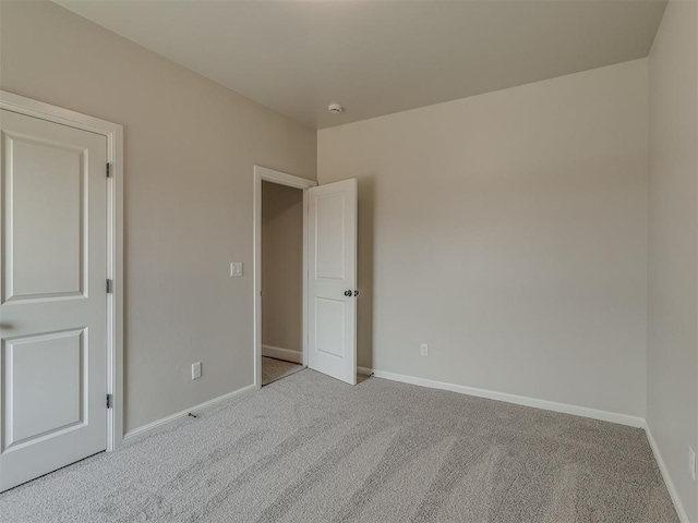 10124 Gentry Xing, Oklahoma City, OK 73169 - spare room with carpet floors and a smoke detector