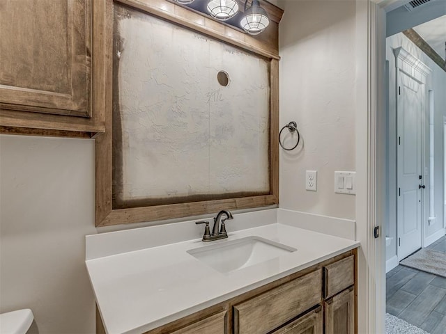 10124 Gentry Xing, Oklahoma City, OK 73169 - bathroom with vanity and wood finished floors