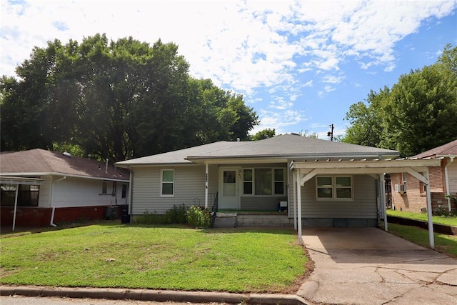 view of front of home with a carport, concrete driveway, covered porch, and a front lawn