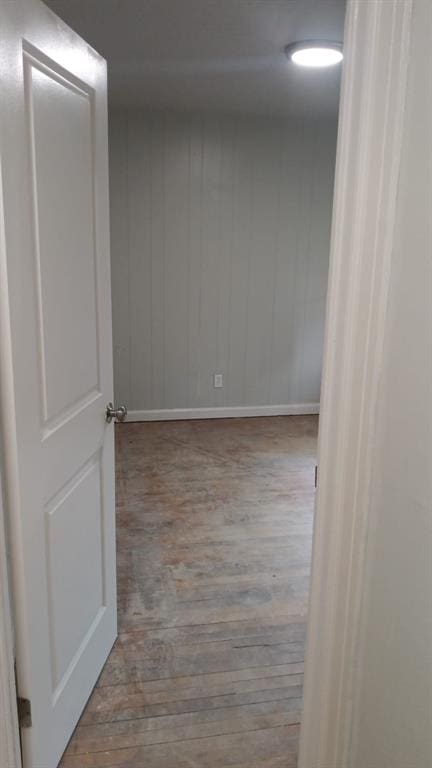 spare room with wood finished floors