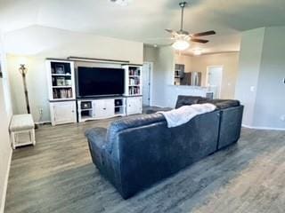 living room with ceiling fan, wood finished floors, and lofted ceiling