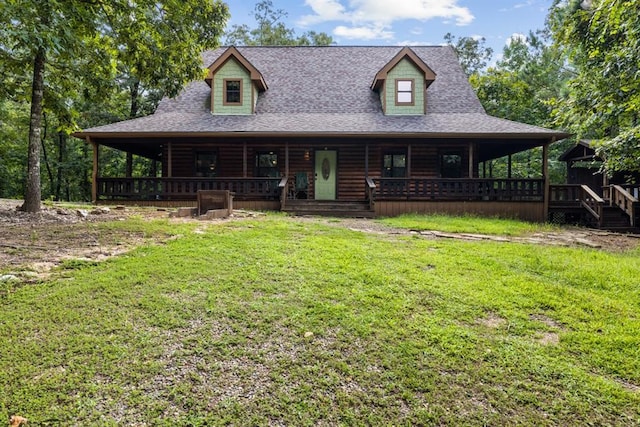 view of front of home with roof with shingles, faux log siding, a porch, and a front yard