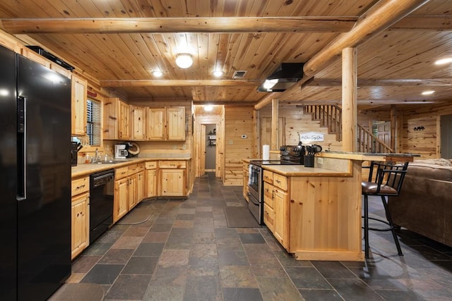 kitchen with wood ceiling, a kitchen breakfast bar, light countertops, light brown cabinetry, and black appliances