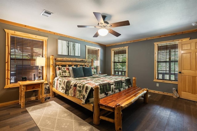 bedroom with a ceiling fan, wood-type flooring, and baseboards