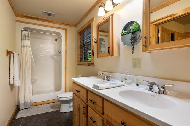 full bath featuring visible vents, a sink, toilet, and double vanity