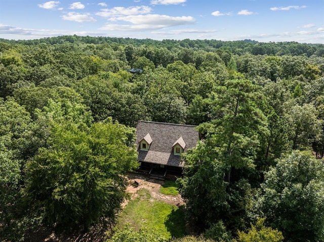 birds eye view of property with a forest view