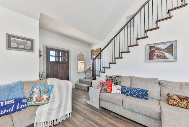 living room with wood finished floors and stairs