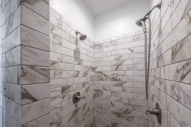 full bathroom with tiled shower