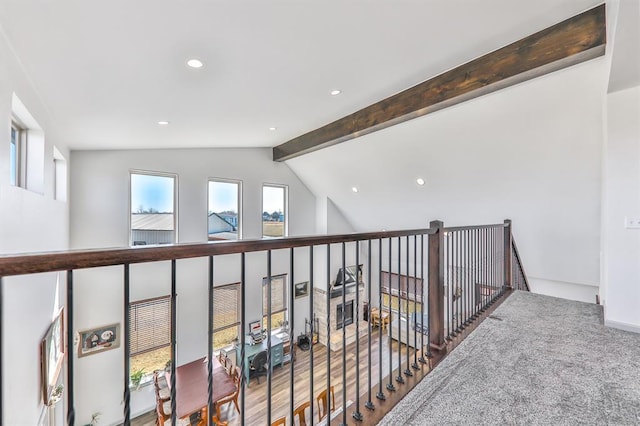 corridor with vaulted ceiling with beams and recessed lighting