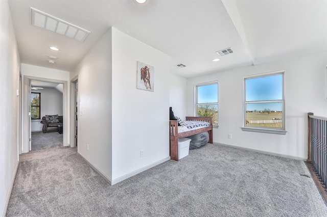 corridor with carpet, visible vents, baseboards, and recessed lighting