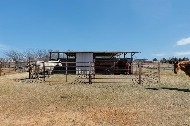 view of horse barn featuring a rural view