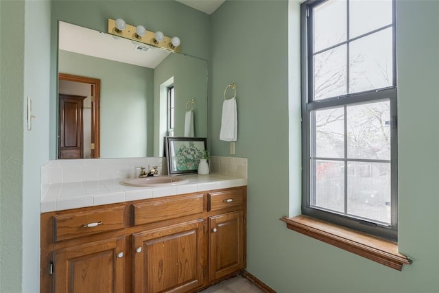 bathroom with visible vents and vanity