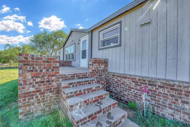 view of property exterior featuring brick siding