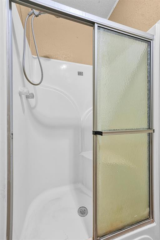 bathroom with an enclosed shower