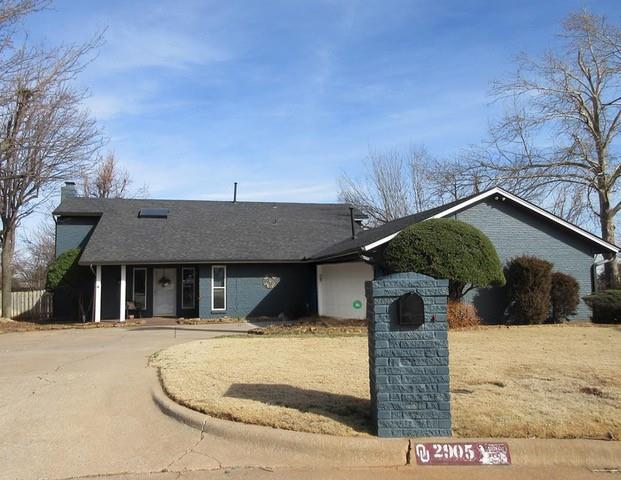 single story home with a chimney