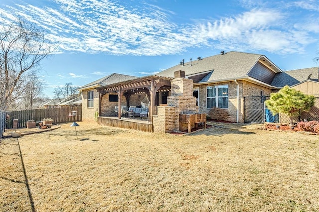 rear view of property featuring brick siding, fence, roof with shingles, a pergola, and a patio area