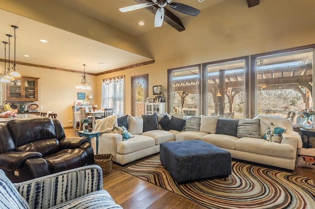 living room with ceiling fan, beamed ceiling, wood finished floors, crown molding, and recessed lighting