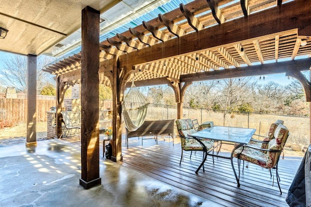 view of patio with outdoor dining area, a fenced backyard, and a pergola