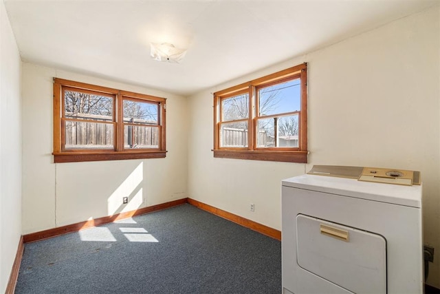 laundry room featuring laundry area, washer / dryer, baseboards, and carpet floors