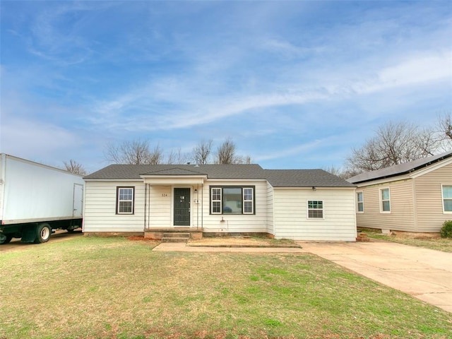 ranch-style home featuring a front yard