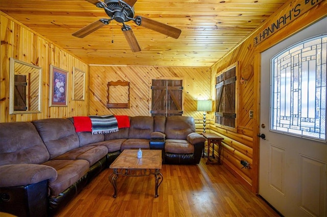 living room with wood ceiling, ceiling fan, and wood finished floors