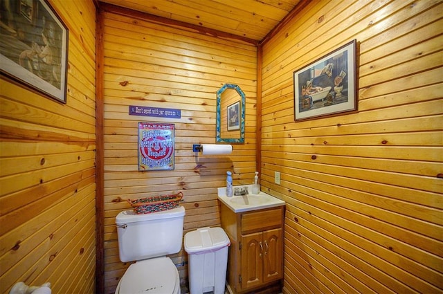 half bath featuring toilet and vanity