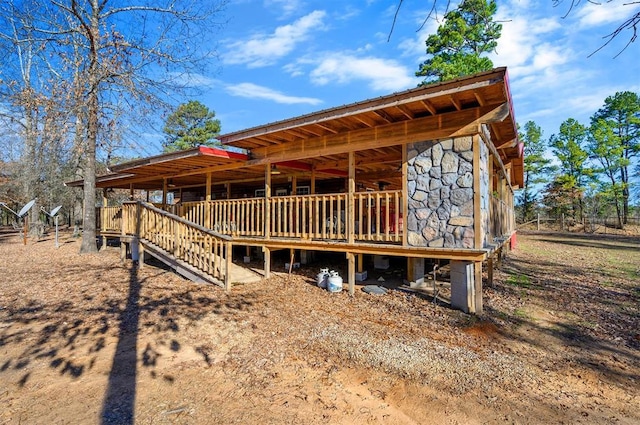 exterior space featuring stone siding