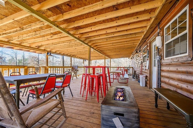 wooden deck featuring outdoor dining space