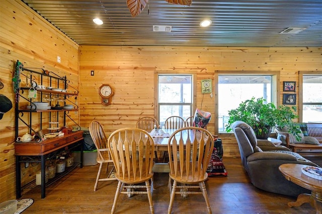 dining space featuring wood finished floors, wood walls, wooden ceiling, and recessed lighting
