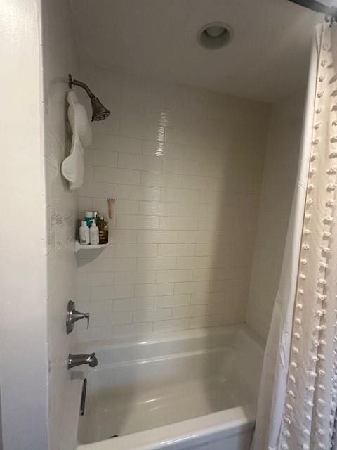 bathroom featuring shower / tub combo with curtain