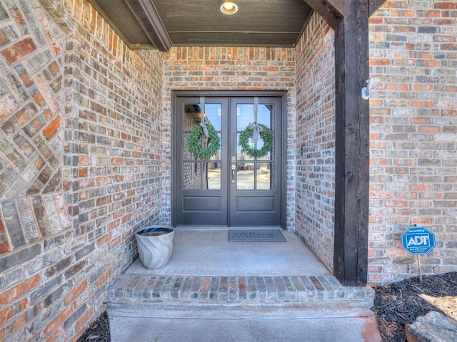 entrance to property with french doors and brick siding