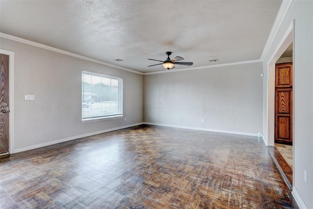 spare room with baseboards, a ceiling fan, and crown molding