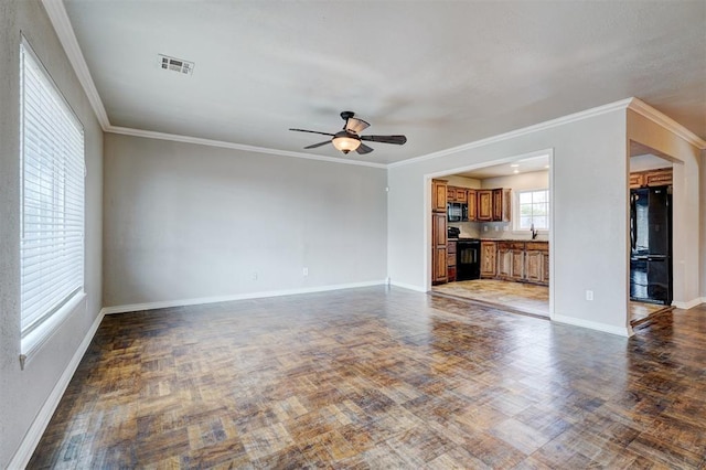 unfurnished living room featuring visible vents, baseboards, wood finished floors, and a ceiling fan