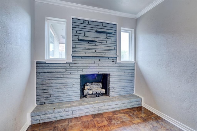 interior details with baseboards, a stone fireplace, ornamental molding, and a textured wall