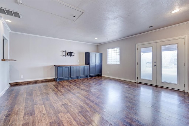 unfurnished room featuring visible vents, baseboards, dark wood-style flooring, and french doors