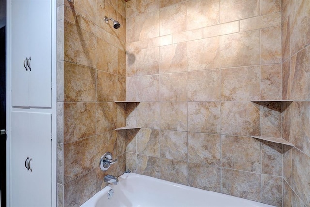 interior details featuring bathtub / shower combination